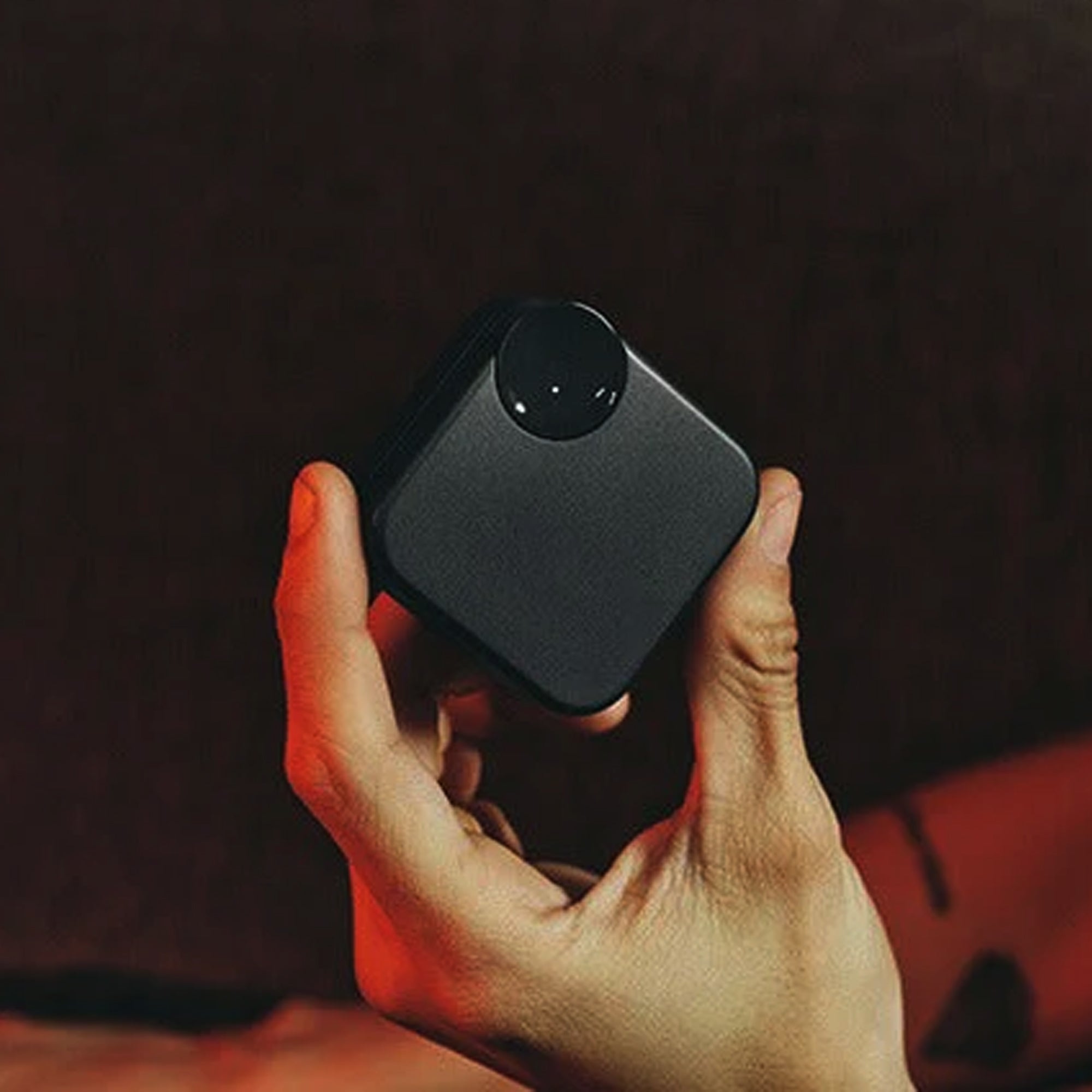 User holding the CTRL8 CMT Ultra Pro noise-cancelling earbuds case in black