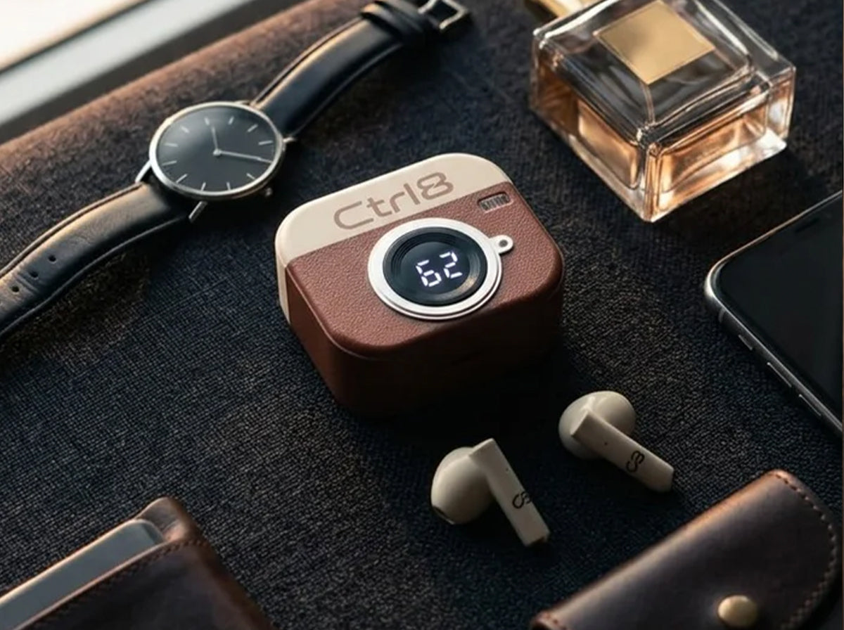 CTRL8 Retro Camera Design Portable TWS Wireless Earbuds displayed on a desk with stylish case and digital battery indicator