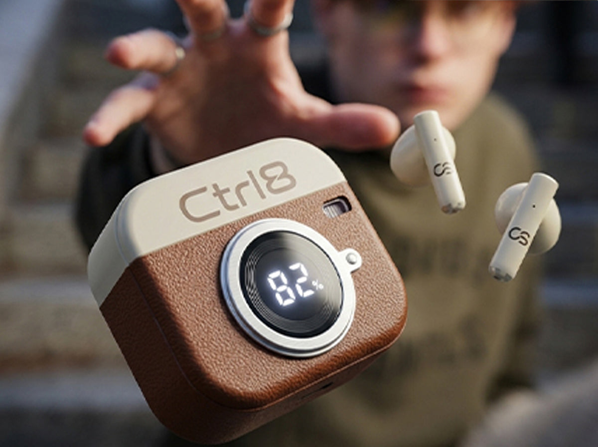 User showcasing CTRL8 Retro Camera Design Portable TWS Wireless Earbuds with stylish case and battery display