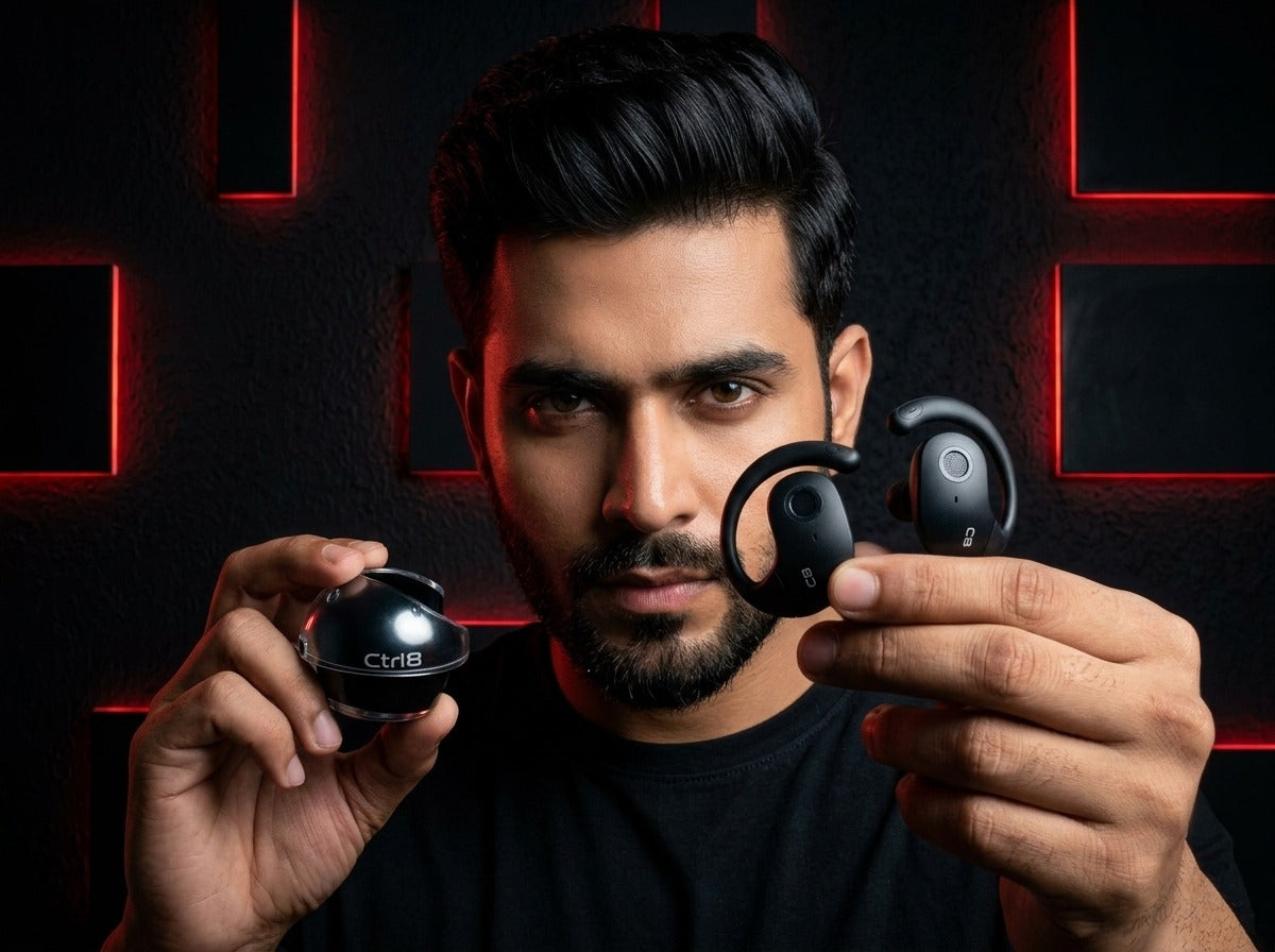 User holding CTRL8 T2 over-the-ear earbuds and charging case, ideal for immersive listening in a gaming-inspired setting.